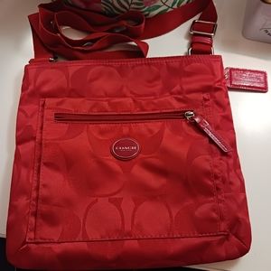 Excellent used Coach Getaway Signature Crimson Nylon Crossbody Bag Style #F77408